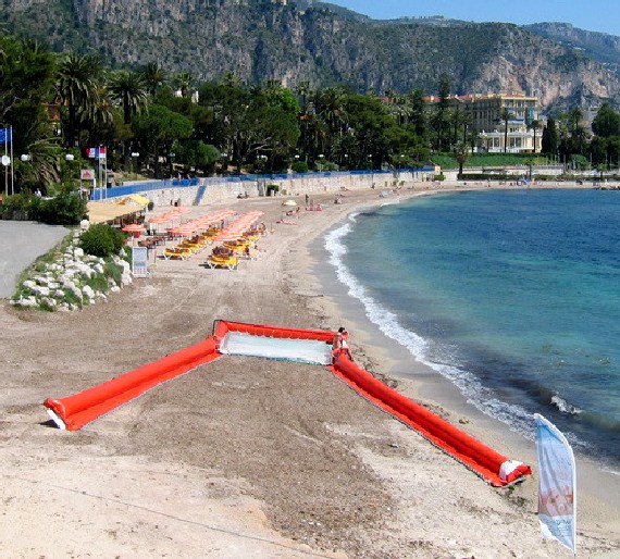 One of the floating trawl booms laid out on a beach